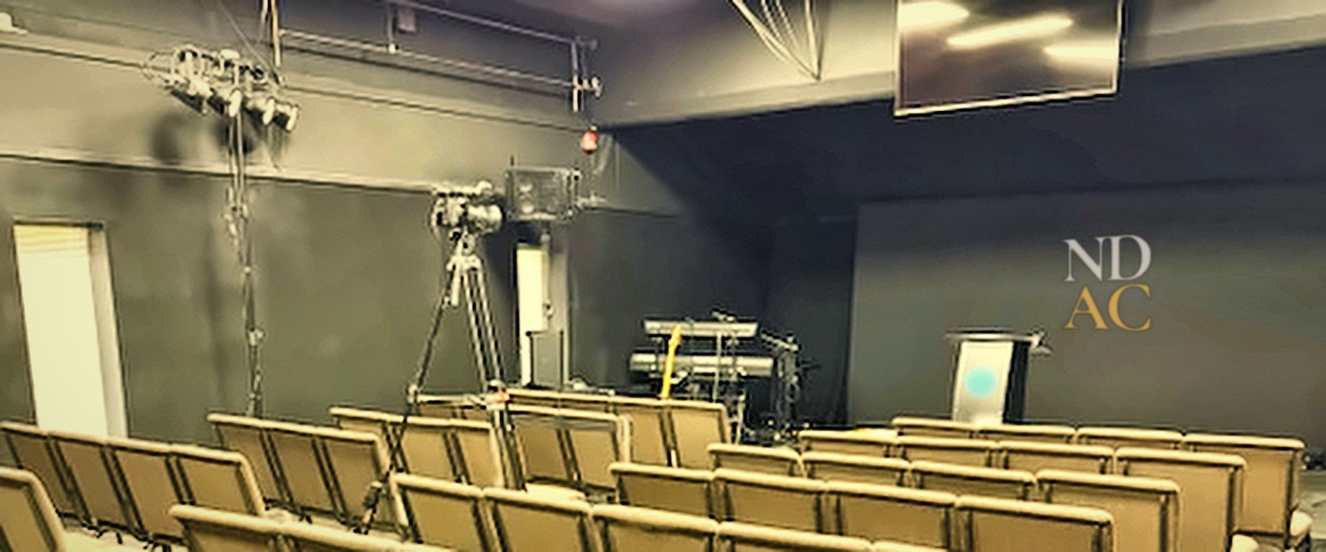The NDAC sanctuary in Providence, with rows of chairs facing the stage and pulpit