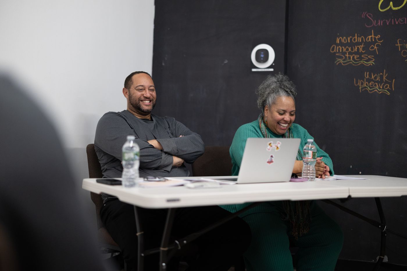 Members laughing together during a class