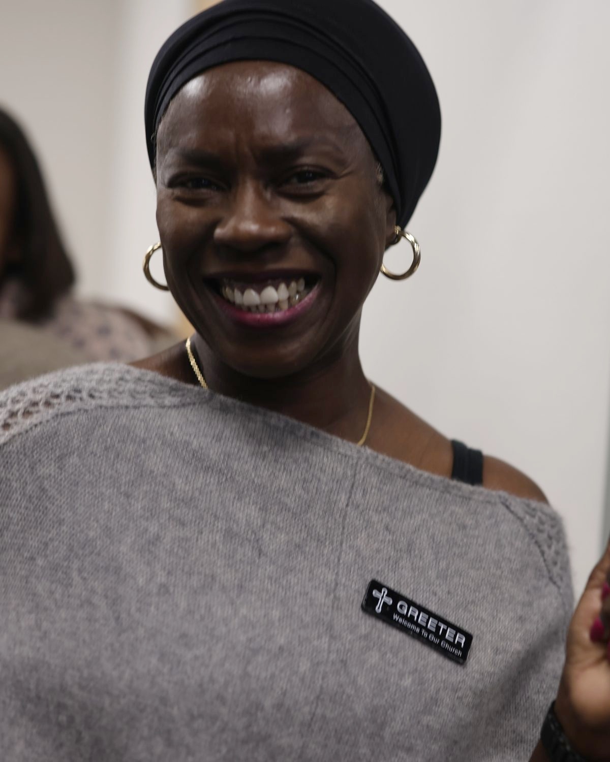 A smiling NDAC greeter