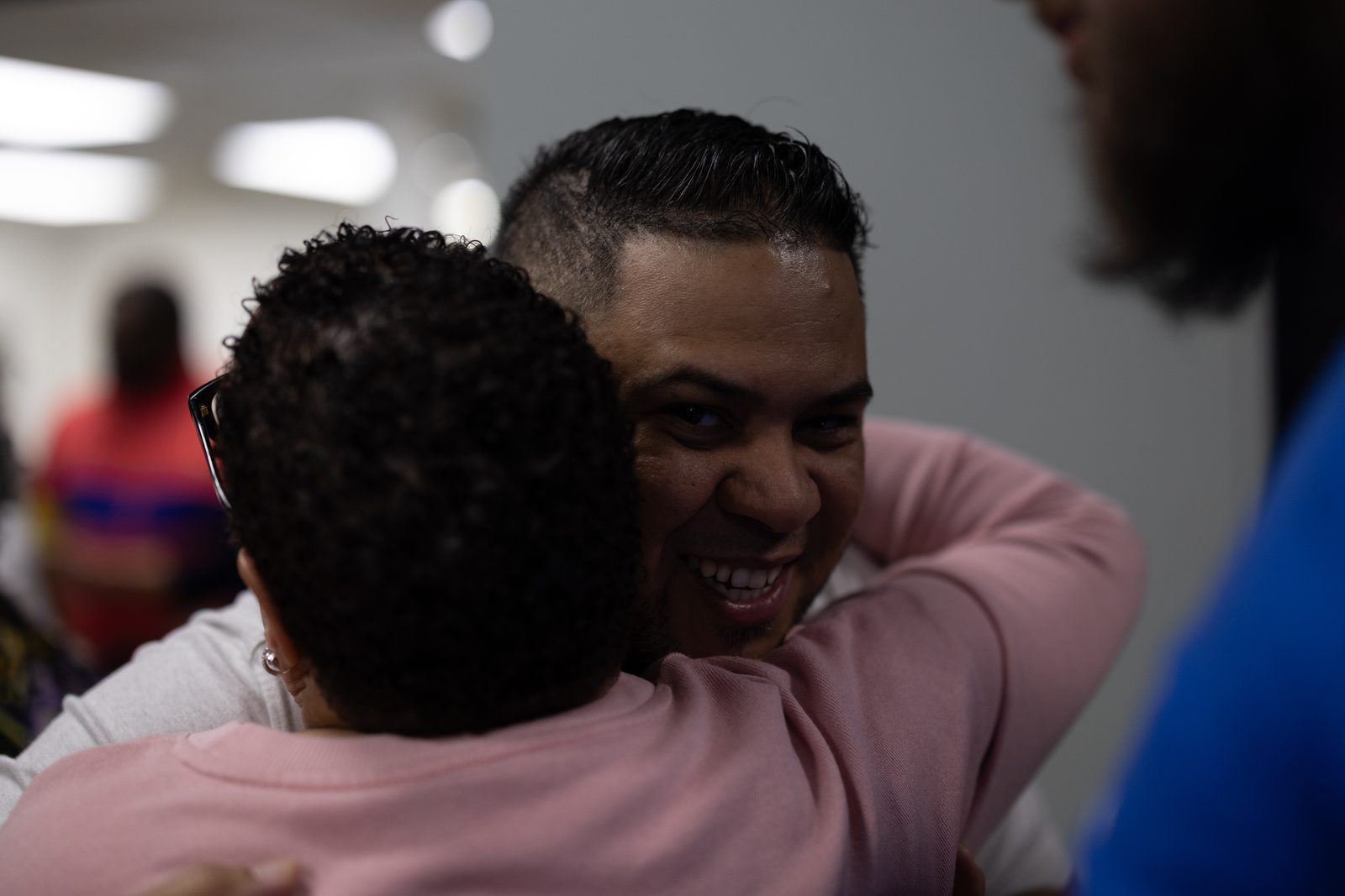 Two church members sharing a warm hug