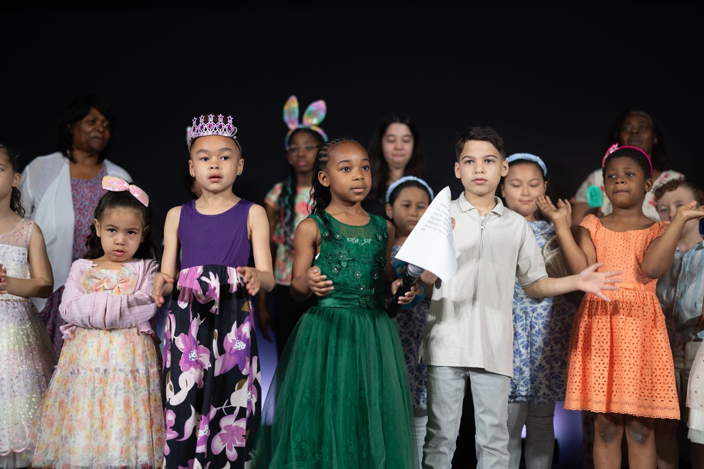 Children singing on stage